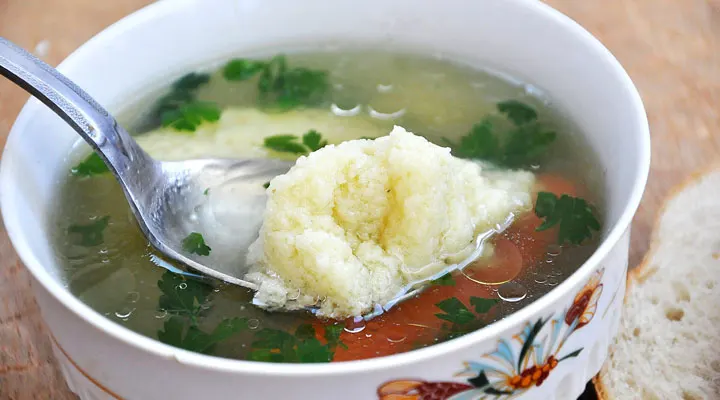 Clear Veggie Soup with Semolina Dumplings Serving supa cu galusti