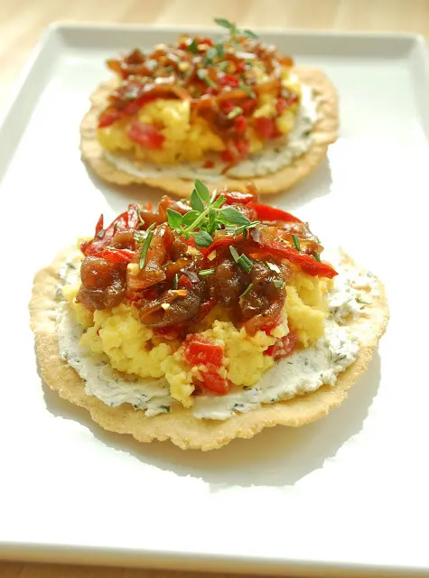 Scrambled Egg Breakfast Tostadas with Caramelized Onions and Herbed Goat Cheese