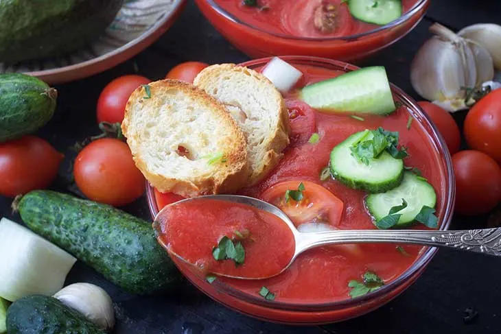 bowl of gazpacho cold soup recipe with fresh raw vegetables on the table