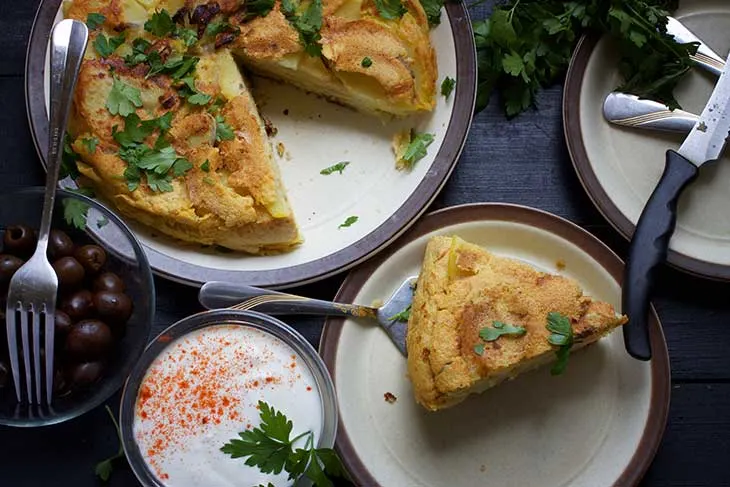 spanish Vegan Potato Tortilla served with olives and cream