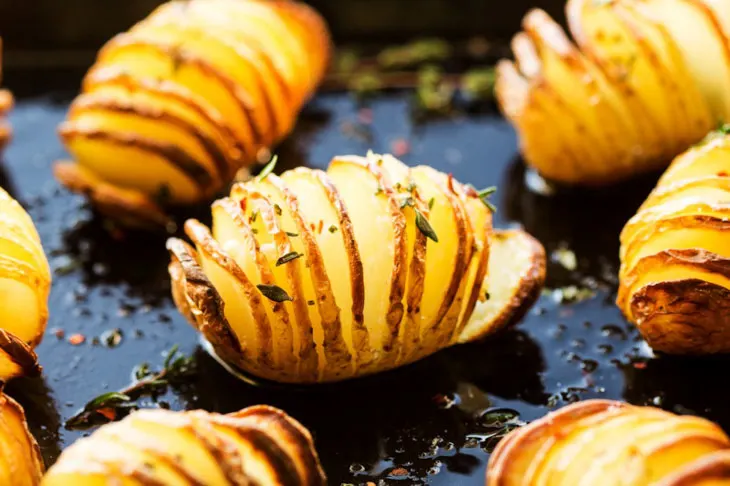 Vegan Hasselback Potatoes in Herby Oil