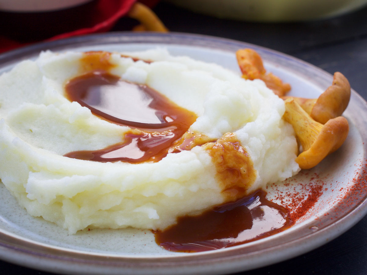 vegan mashed potatoes with vegan gravy sauce and mushrooms