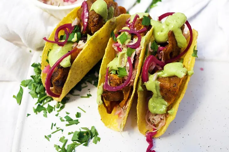 Cauliflower tacos BBQ flavored with avocado sauce