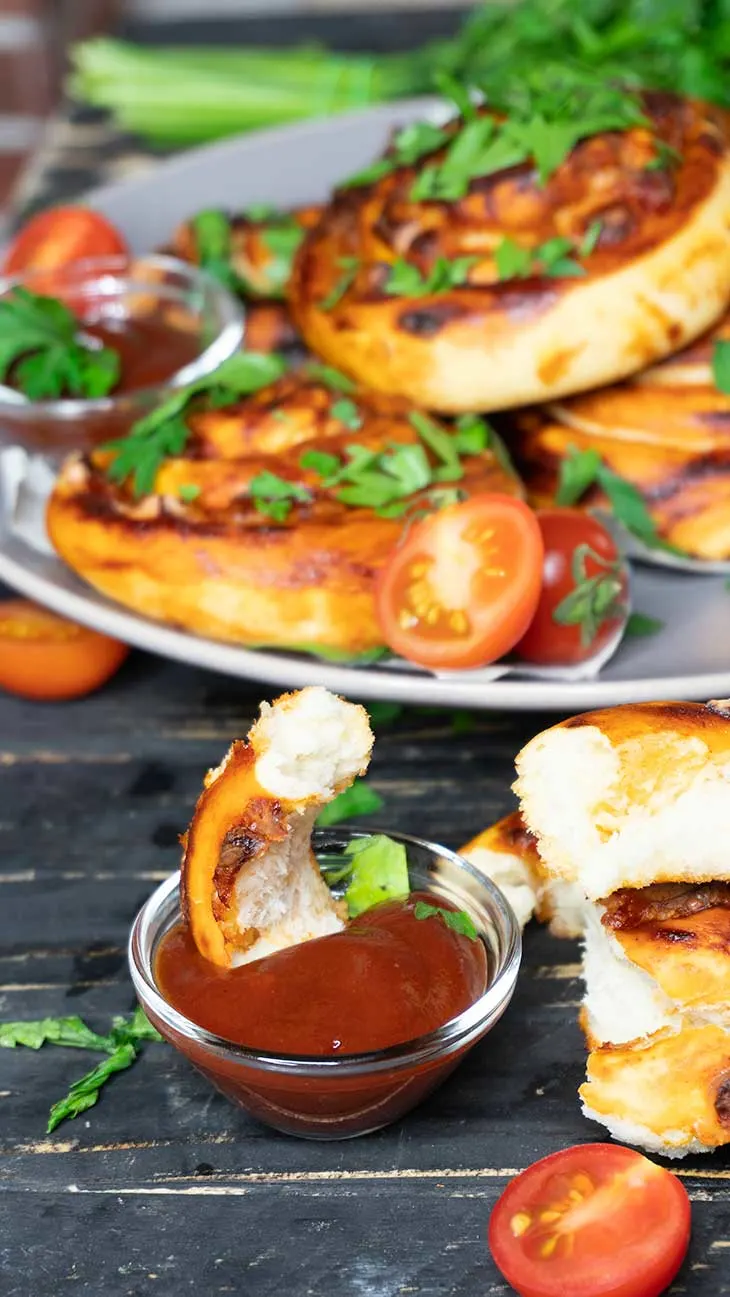 Vegan Pizza Pinwheels in sauce