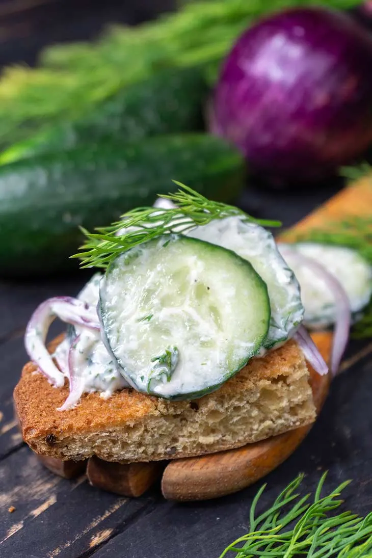 Creamy cucumber salad on toast