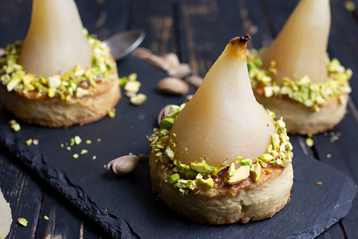 White Wine Poached Pears with Vanilla-Pistachio Blondie Dessert