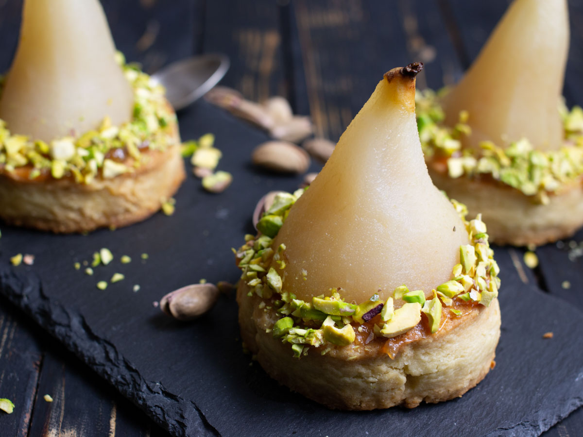 White Wine Poached Pears with Vanilla-Pistachio Blondie Dessert