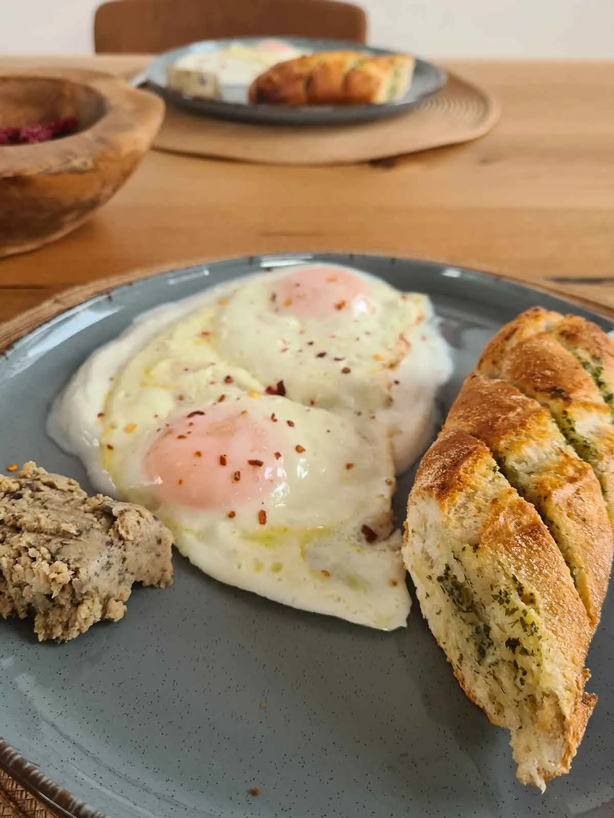 sunny side up eggs breakfast with garlic bread