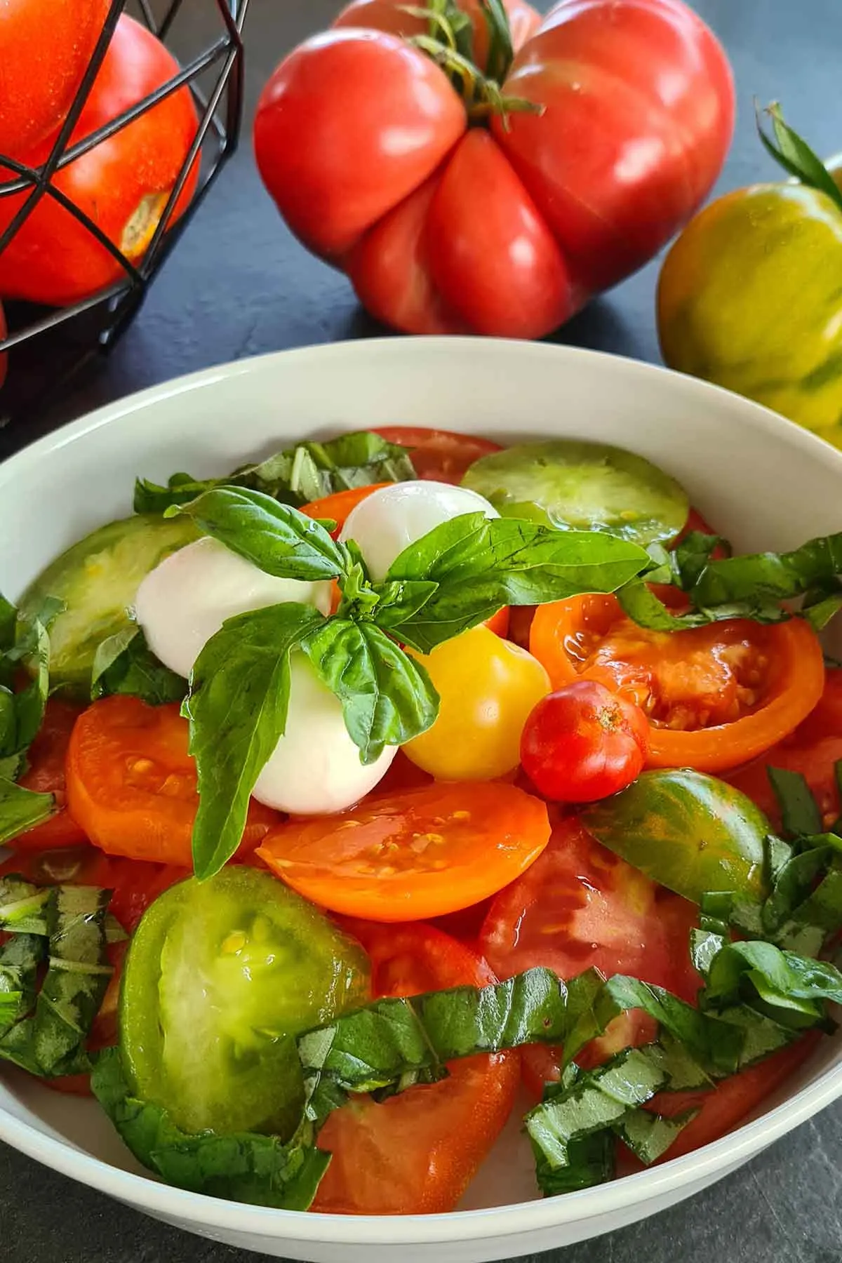 Fresh tomatoes salad with mozzarella di buffala and basil salata de rosii cu mozzarella de bivolita si busuioc