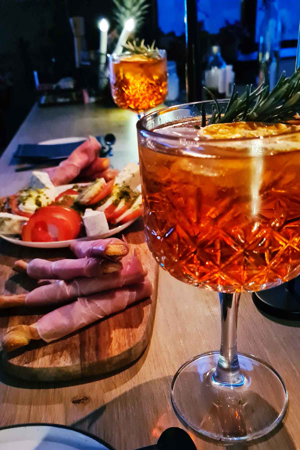 Italian aperitivo Aperol tonic served with nibbles