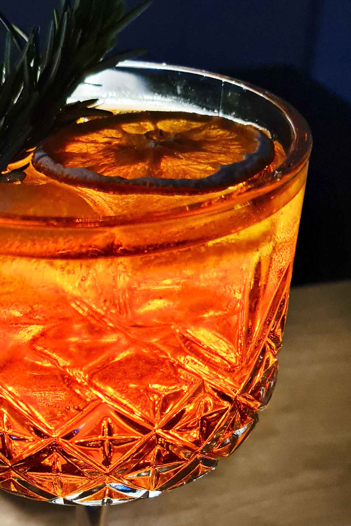 Bright orange Aperol tonic topped with tonic water and orange