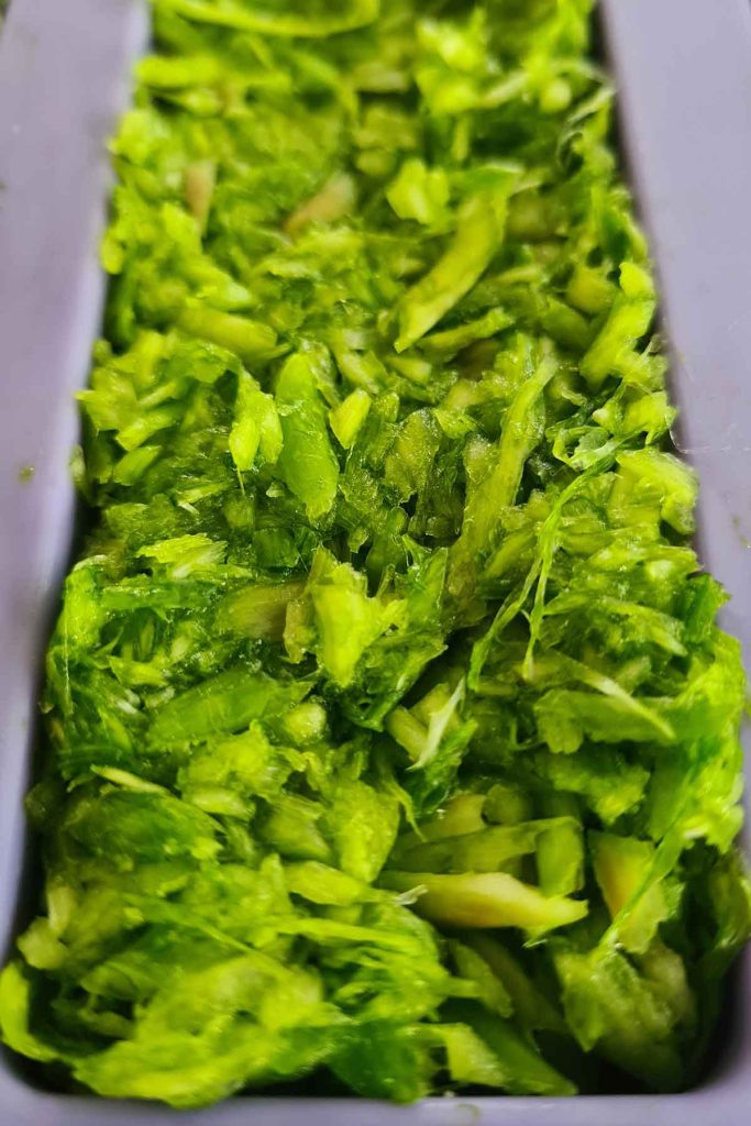 Frozen garlic scapes in a bag, stored for winter cooking