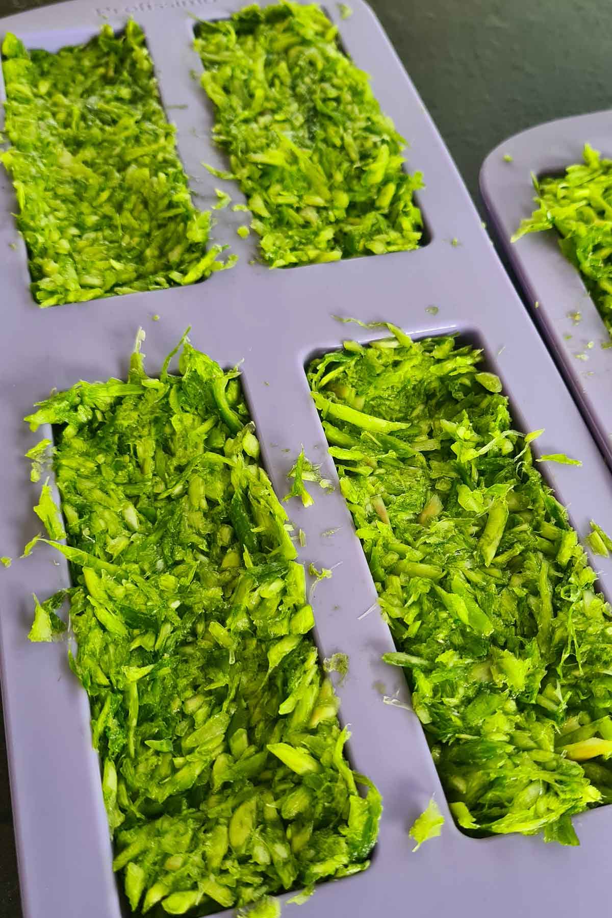 Chopped garlic scapes laid out to freeze for winter