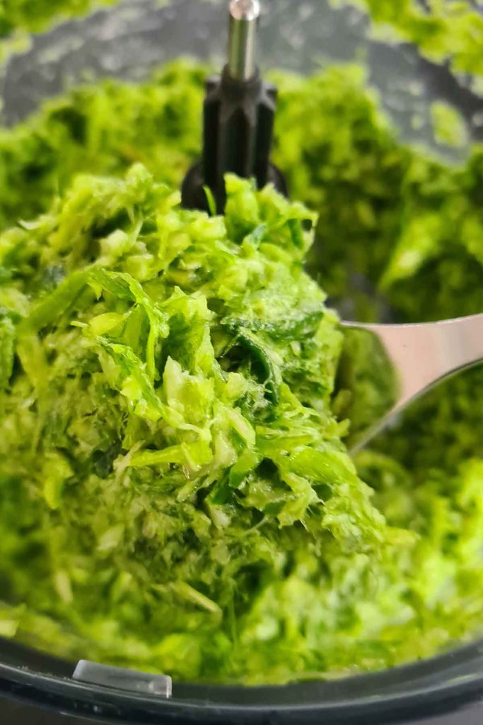 Blending garlic scapes into a paste to freeze in portions