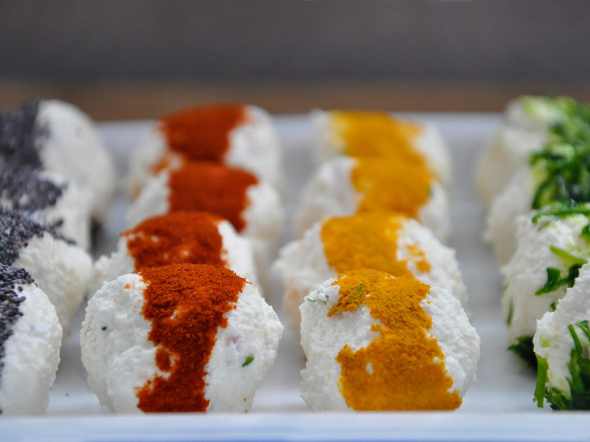 Vegetarian cheese bites in different spice coatings