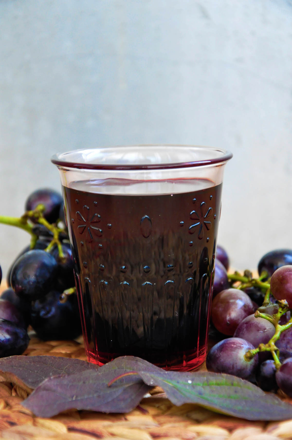 Blackcurrant and grape juice served over ice