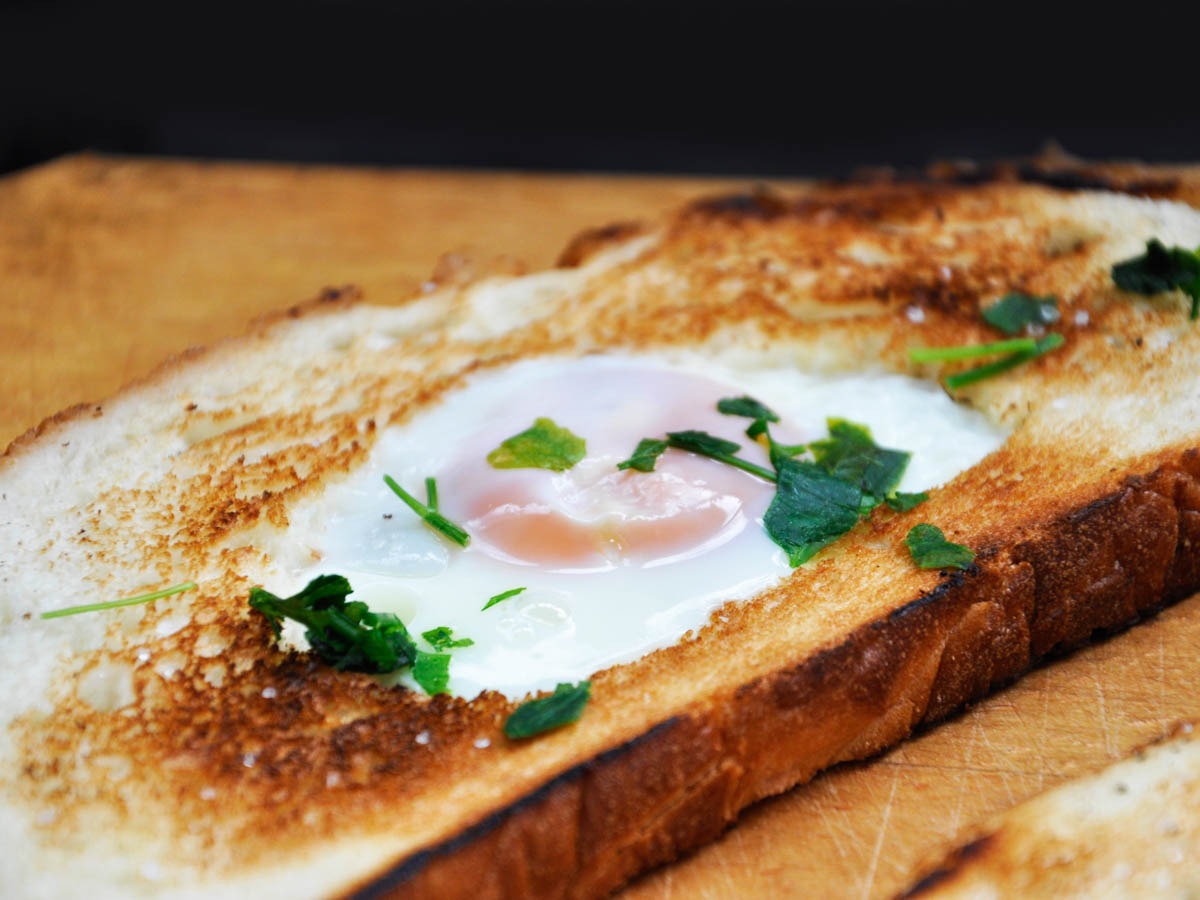 Golden egg in a hole on a plate