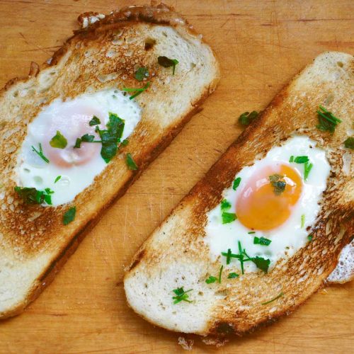 Egg-in-a-hole breakfast toast with runny yolk