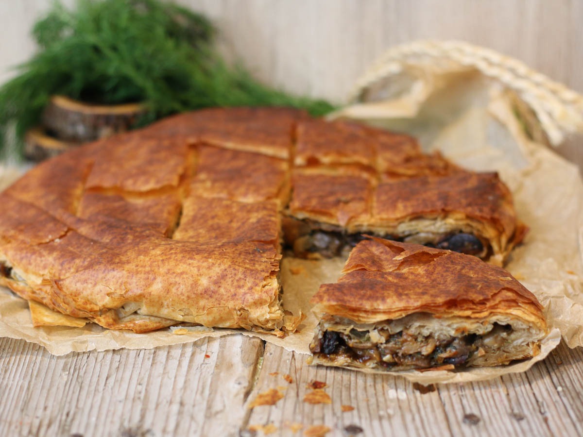 Flaky filo layers on a rustic mushroom pie