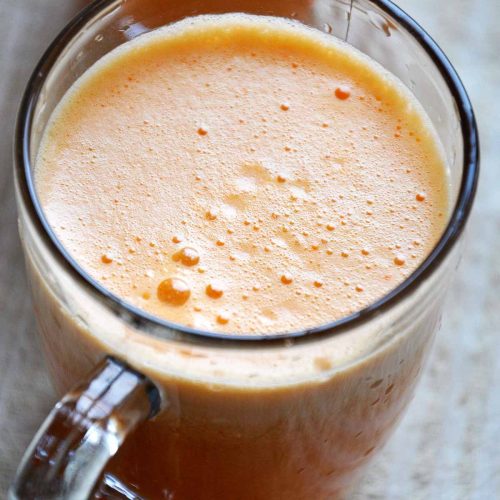 Homemade apricot juice served cold in glass mugs