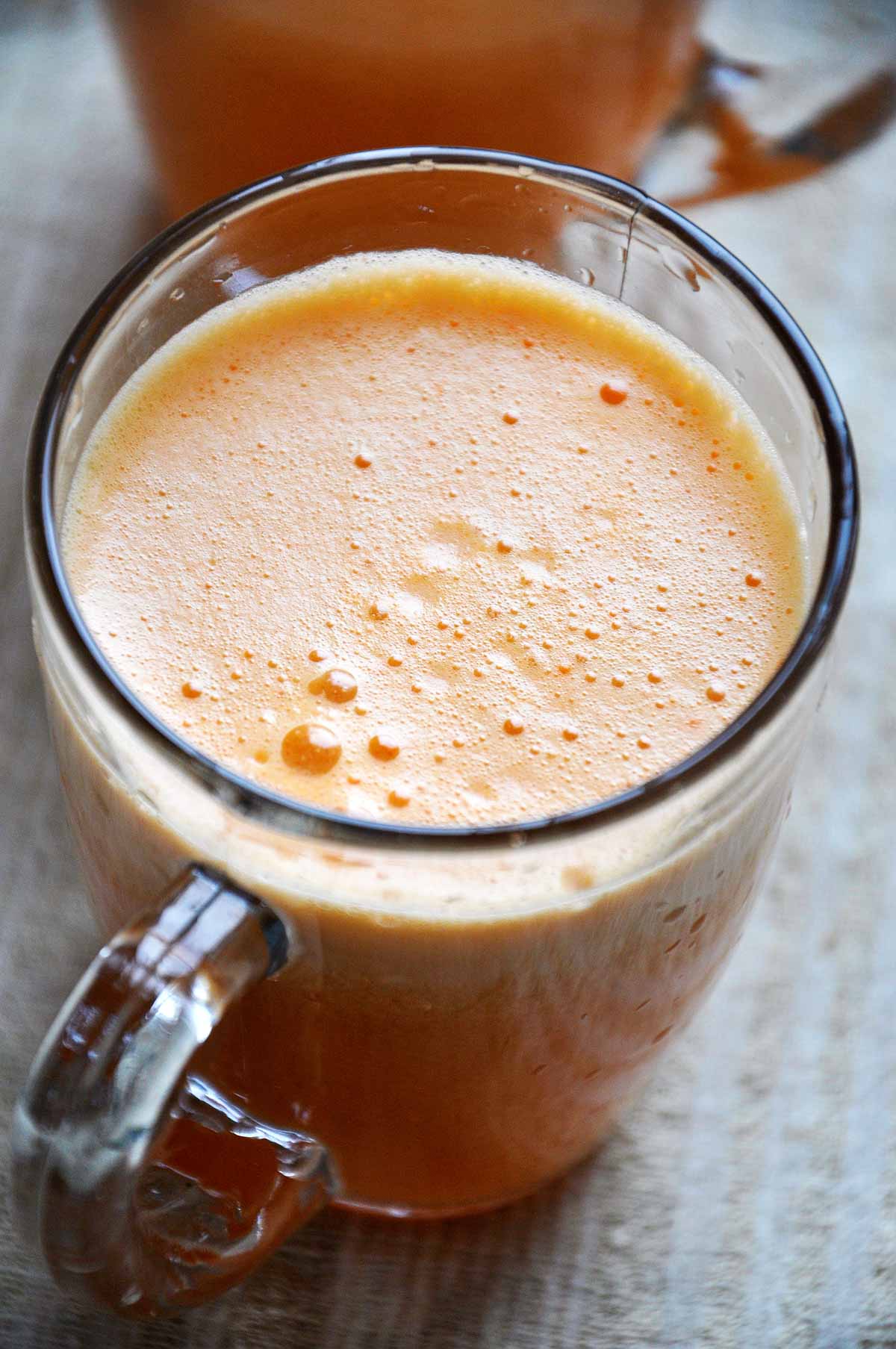 Homemade apricot juice served cold in glass mugs