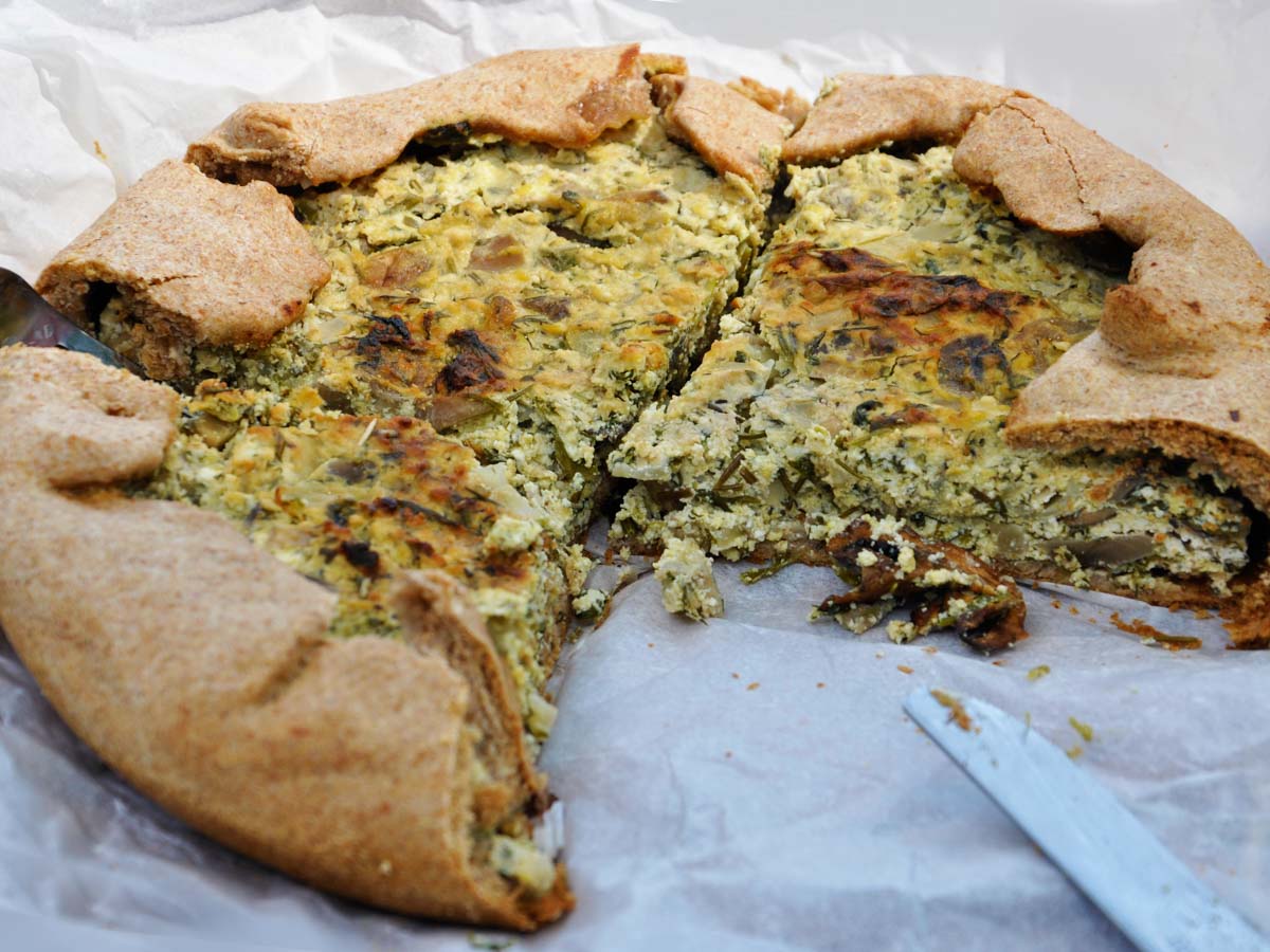 Golden free-form mushroom galette with a folded crust