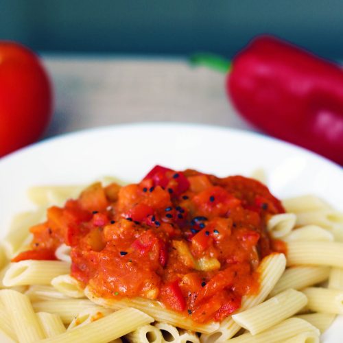 Chunky red pepper tomato sauce on pasta