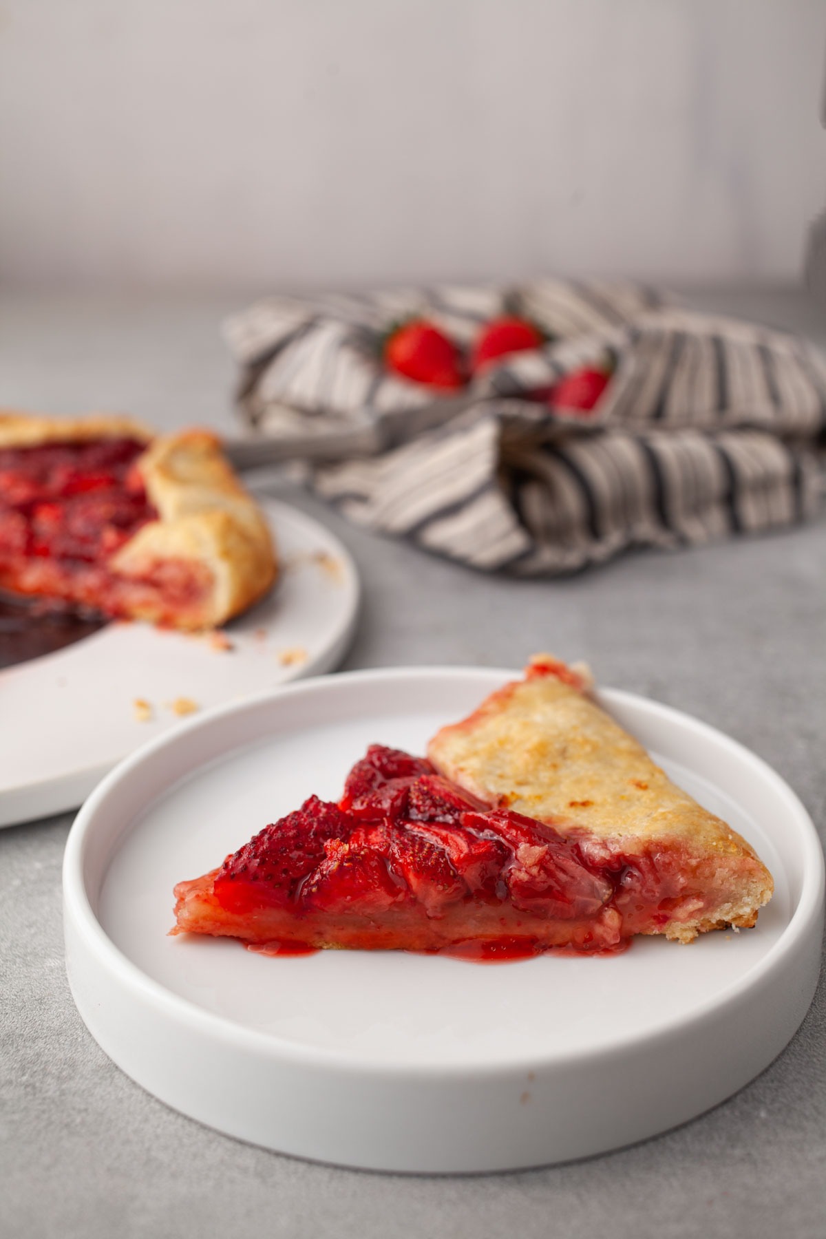 Slice of strawberry galette with juicy berries