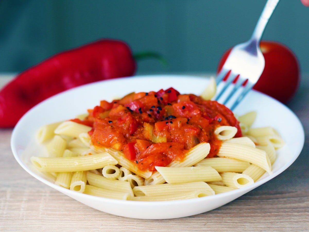 Red pepper and tomato pasta sauce over penne