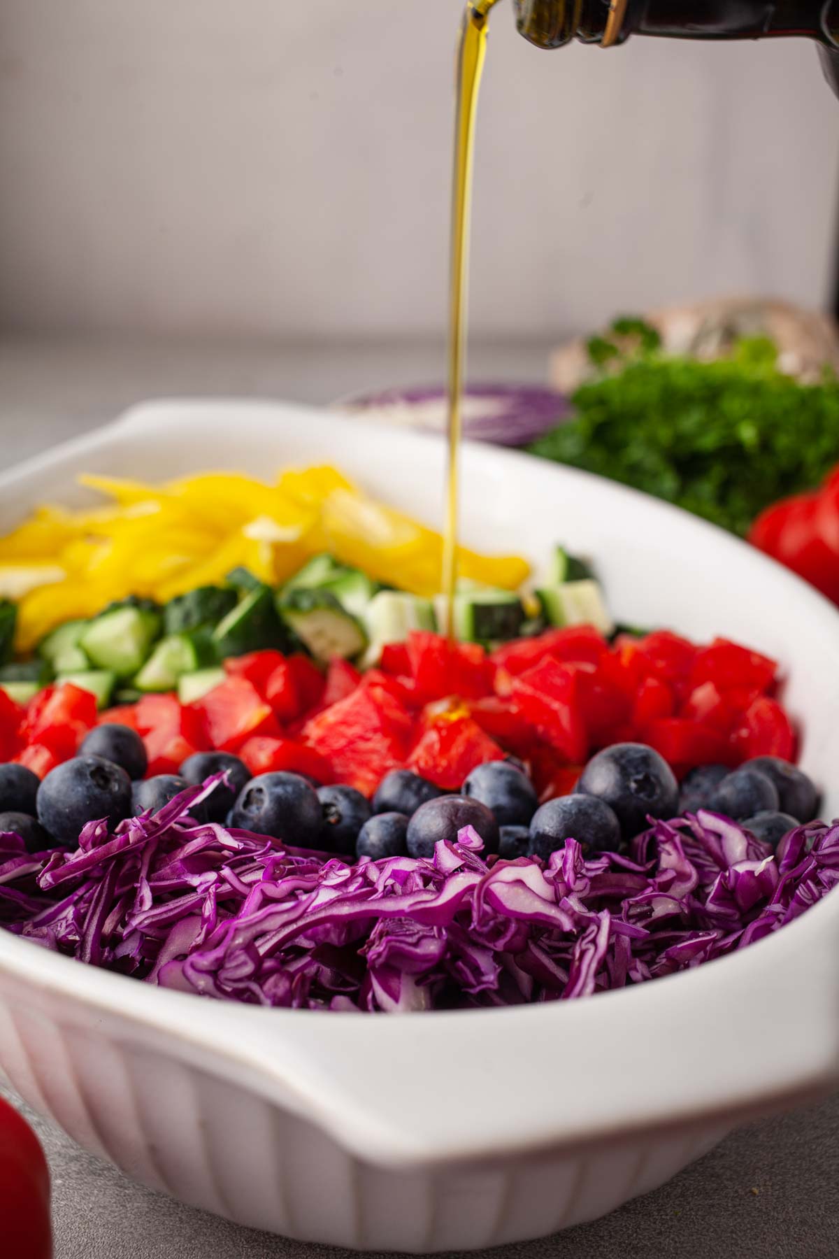 Vegan rainbow salad tossed with fluffy quinoa and fresh vegetables