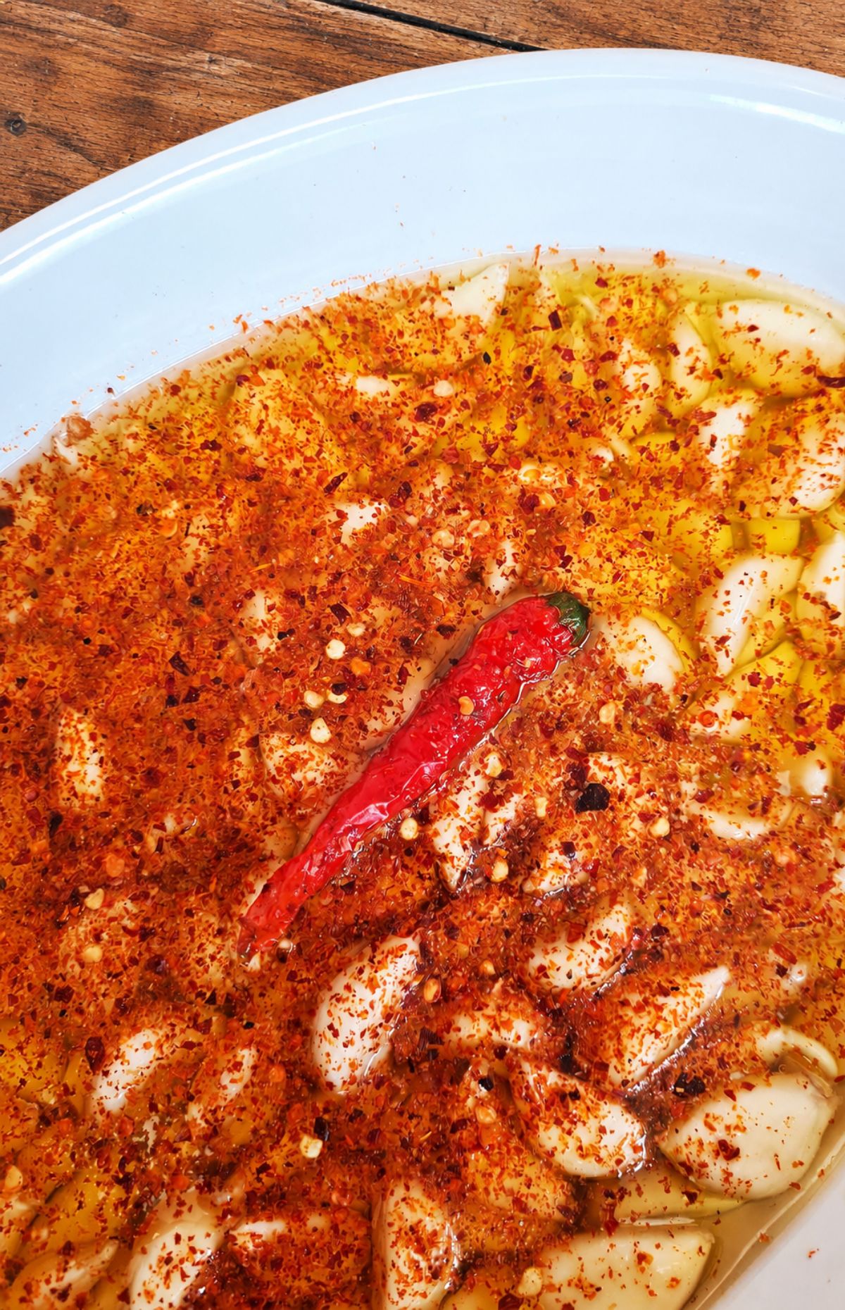 Spicy garlic confit cloves in chili oil