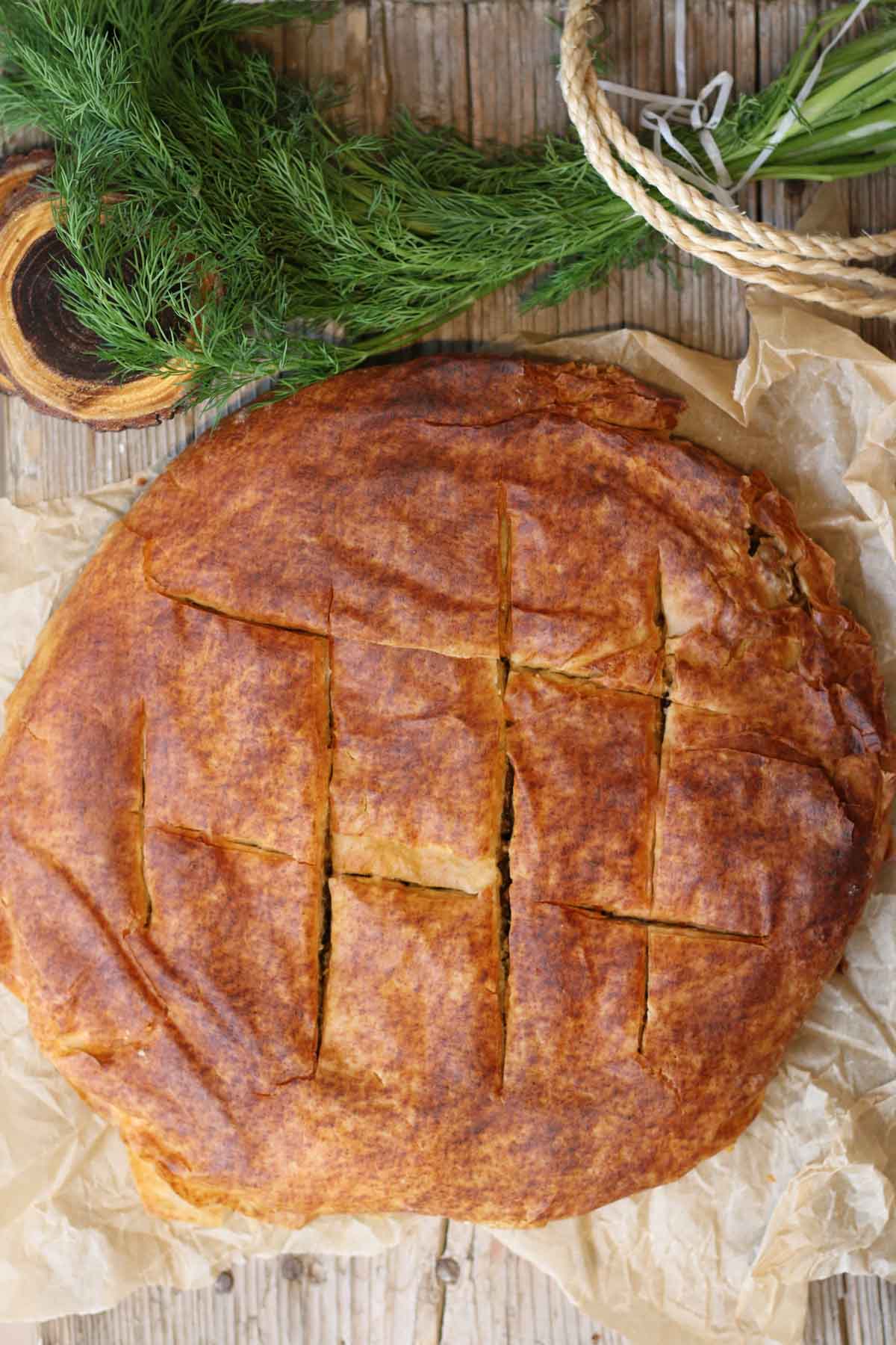 A slice of mushroom filo pie showing the savory filling